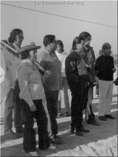 César (in dark jacket) with farm workers during 1973 Grape Strike - picket line.