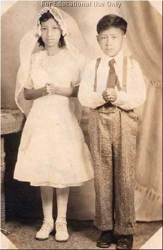 C&eacute;sar and his sister are dressed for their First Holy Communion.