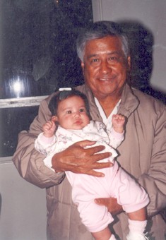 César E. Chávez with a young child